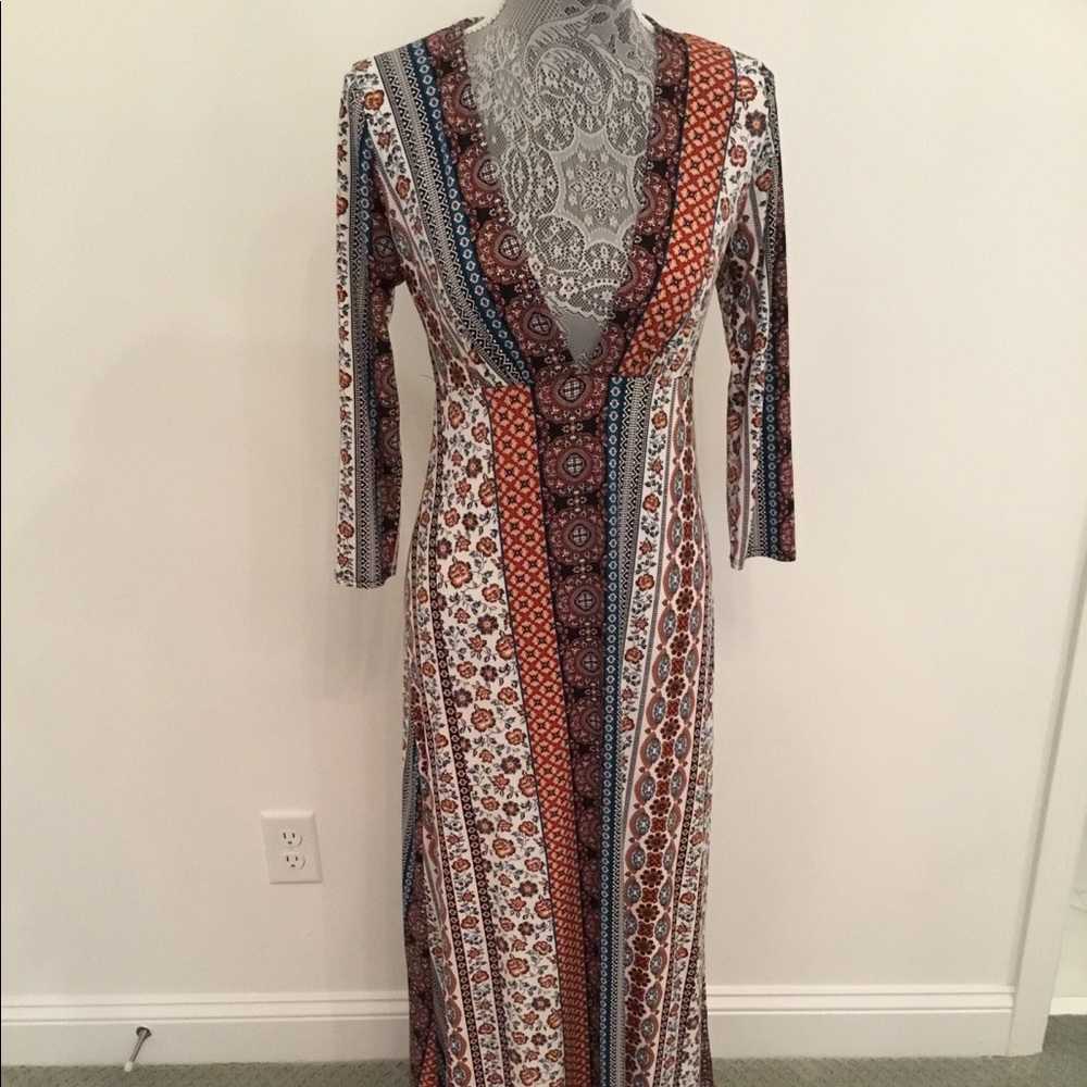 Long sleeved, fitted maxi dress.